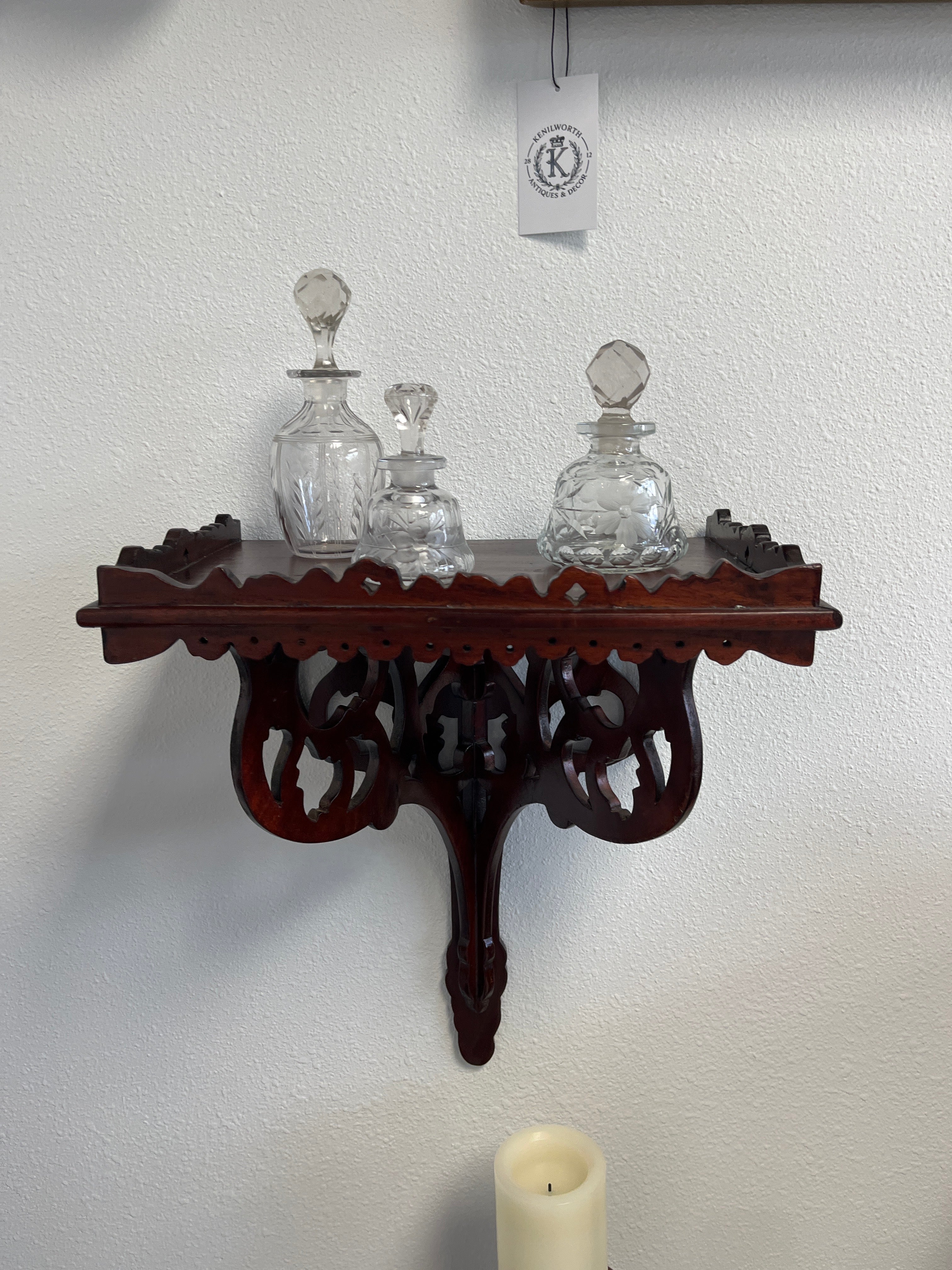 A hand-carved Mahogany wall/clock shelf