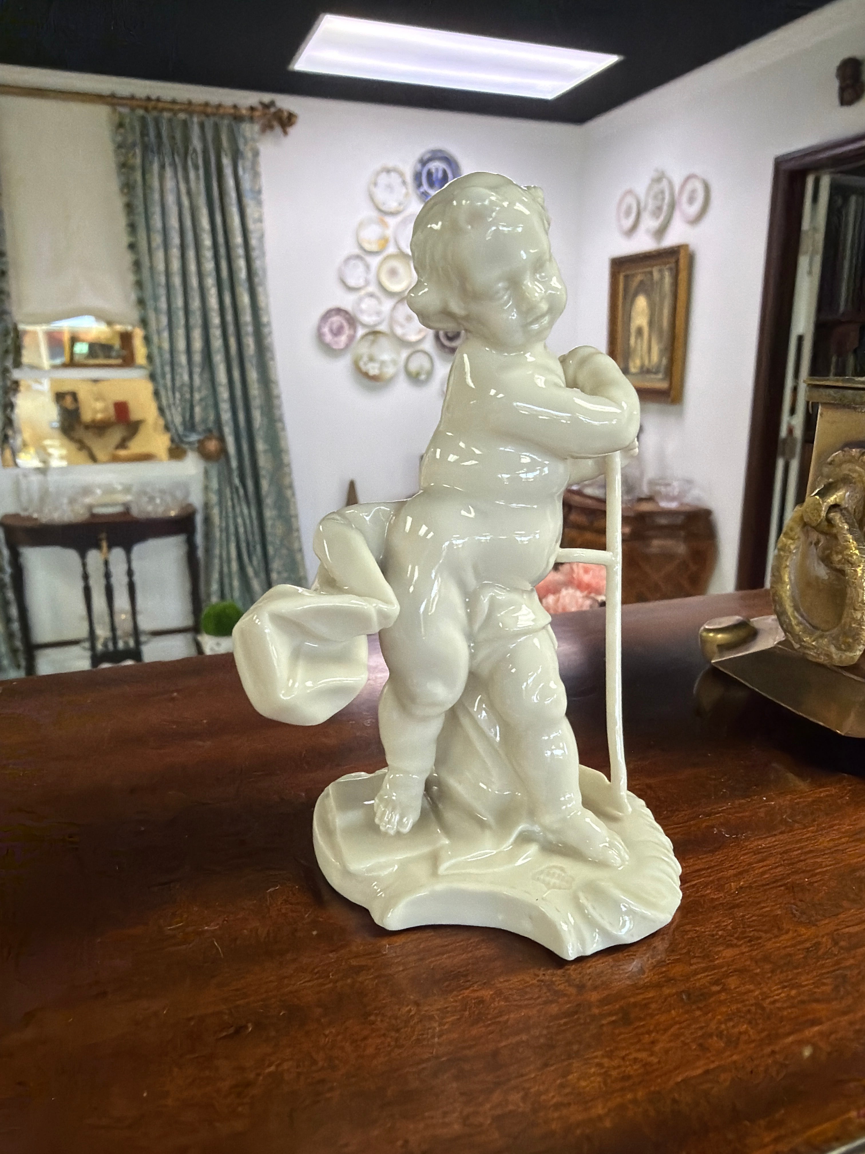 Nymphenburg porcelain - "Putto as Saturn"