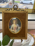 Hand-painted 18th-century miniature portrait of a woman, signed 'Gomi'.